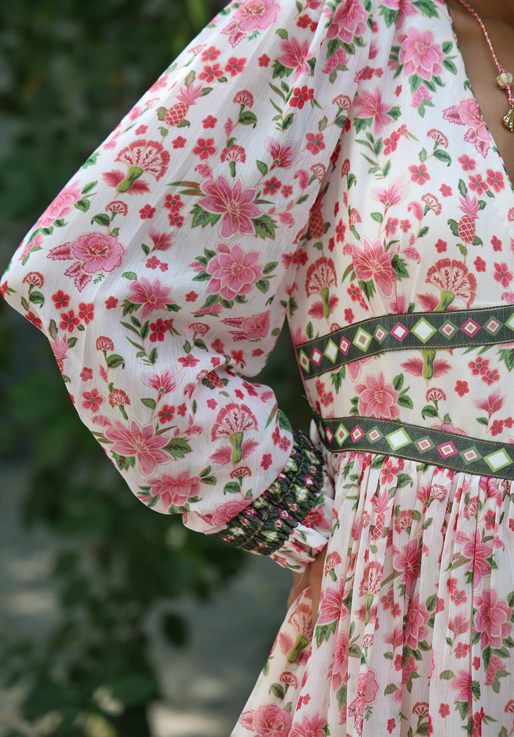 Close-up of voluminous sleeve detail on Elysia dress
