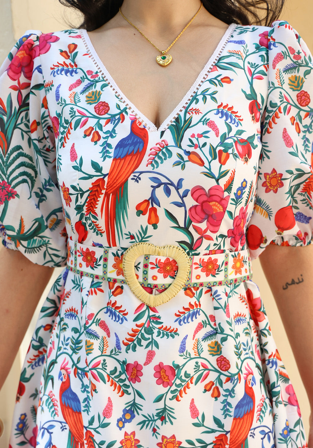 Close-up of floral print and belt detail on June dress