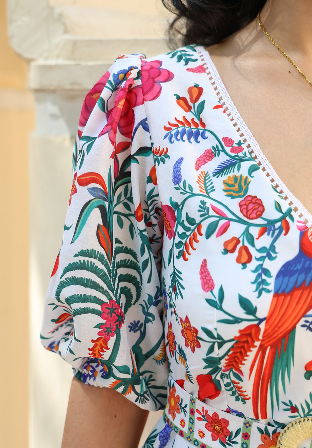 Close-up of puff sleeve and floral print on June dress