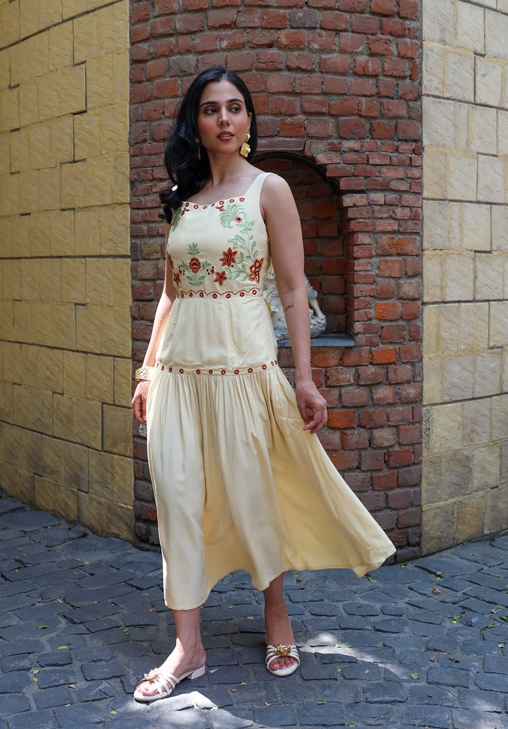 Front angled view of Marigold dress with flowy gathered skirt