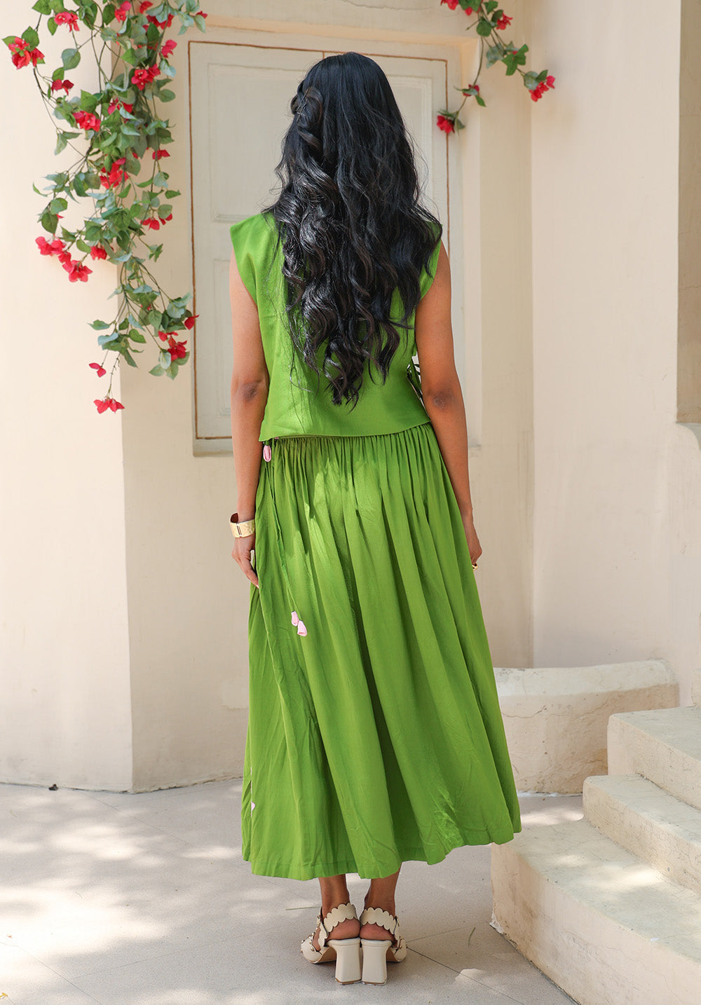 Back view of the Olive Bloom coord set featuring a meadow green gathered skirt and floral motif crop top from Arcadian Dream SS’26.